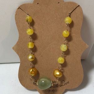 Glass beaded bracelet, measures 8 in, green and yellow colors, gold tone